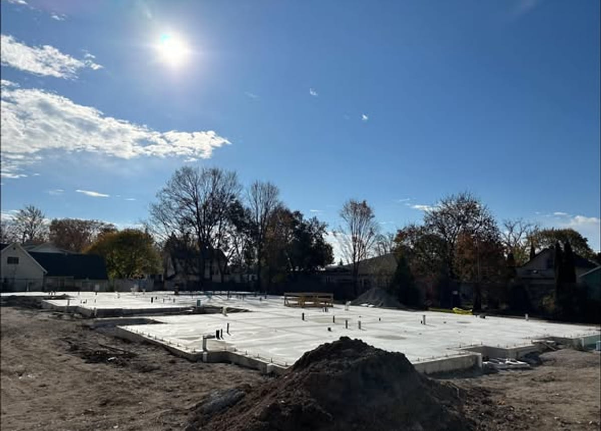 A poured concrete pad with footings