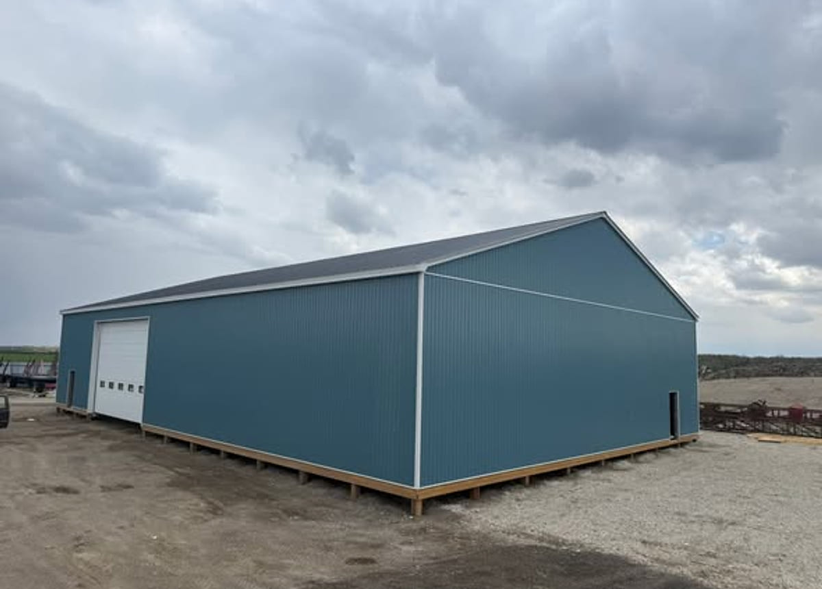 A steel building seen from the gable end